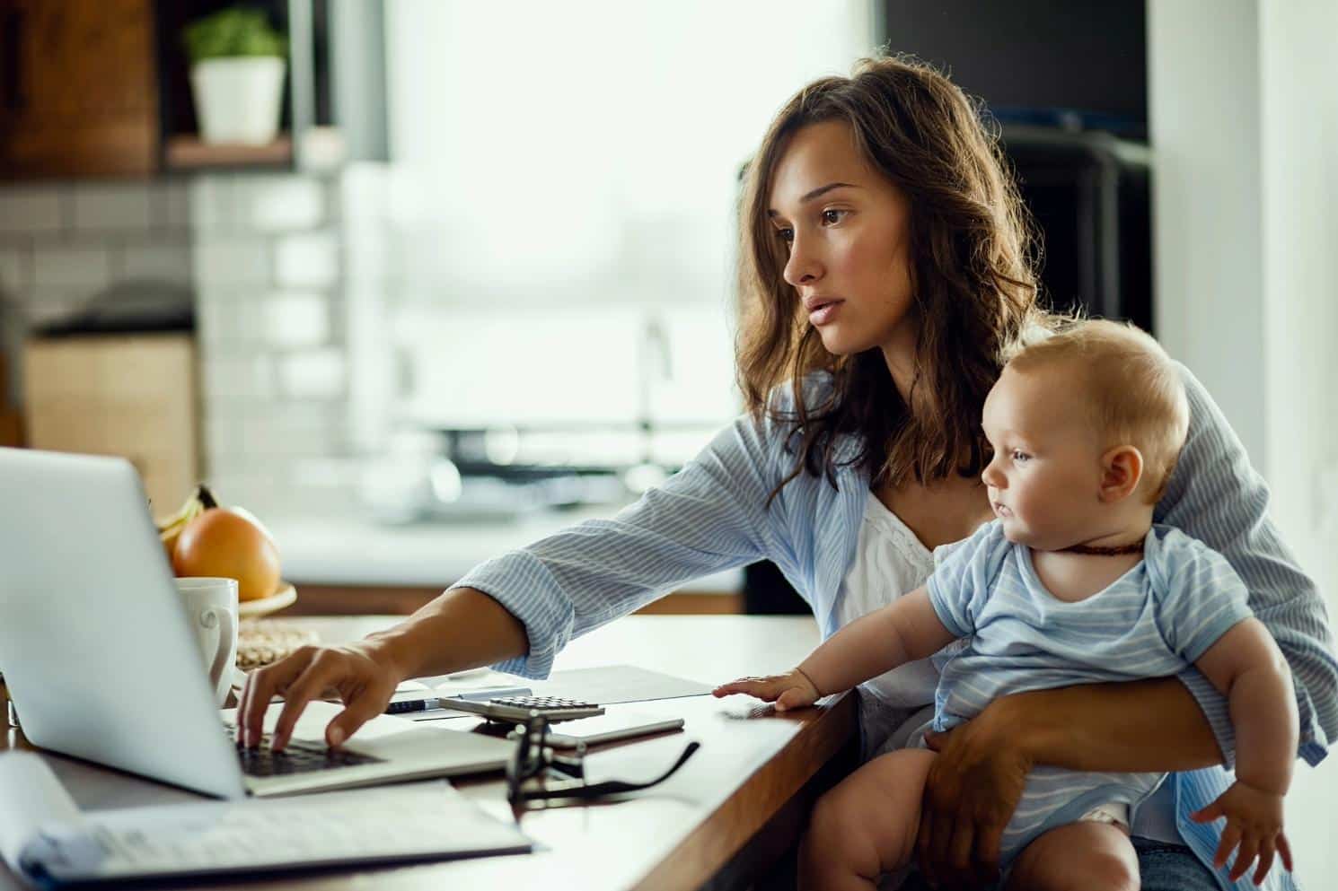 mom and baby figuring out finances